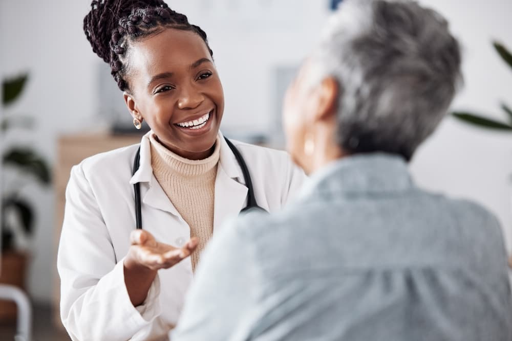 A healthcare professional consults with an incoming hospital patient